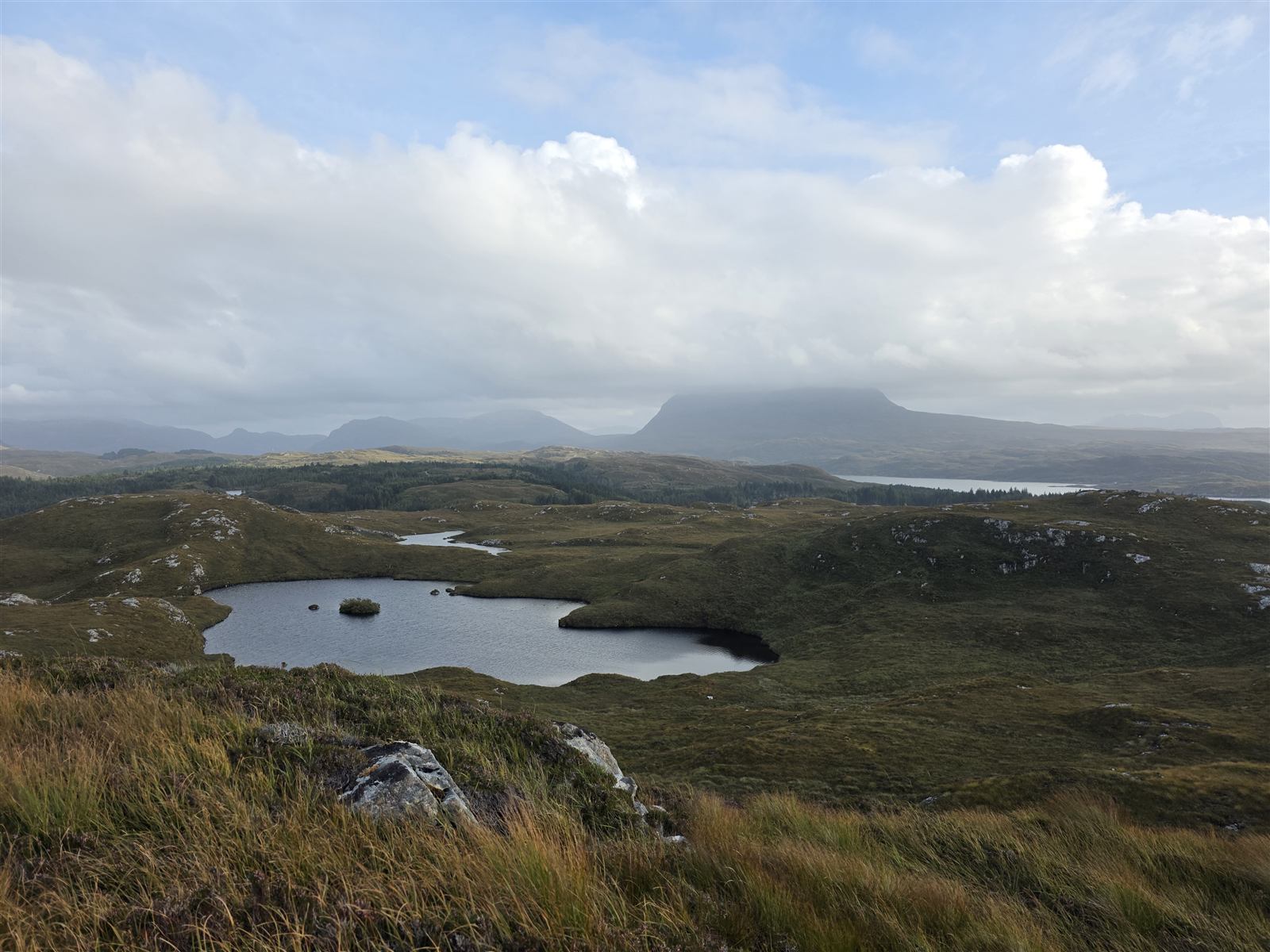 A hill loch in Sutherland with Ben Stack and Foinaven behind